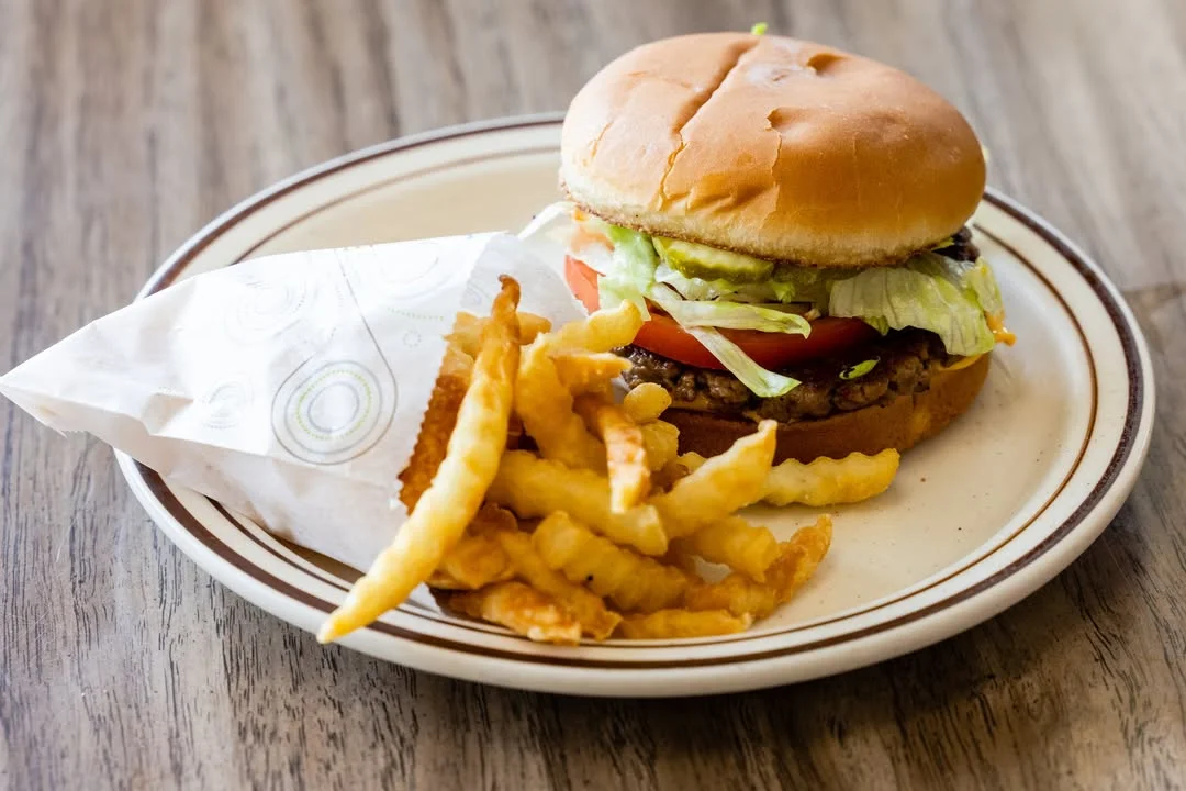 Classic American cheeseburger with crinkle-cut fries