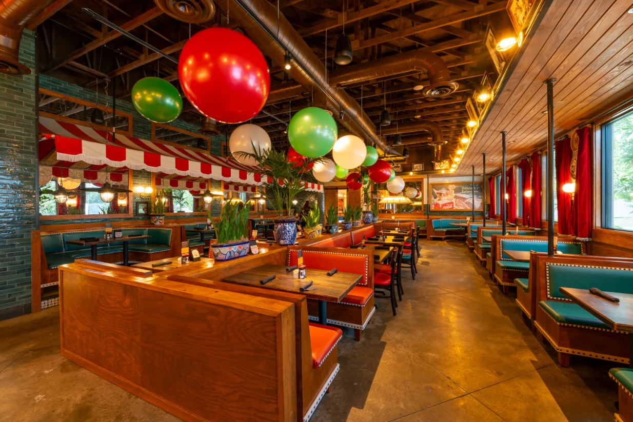 Vibrant restaurant interior with festive decor and colorful seating
