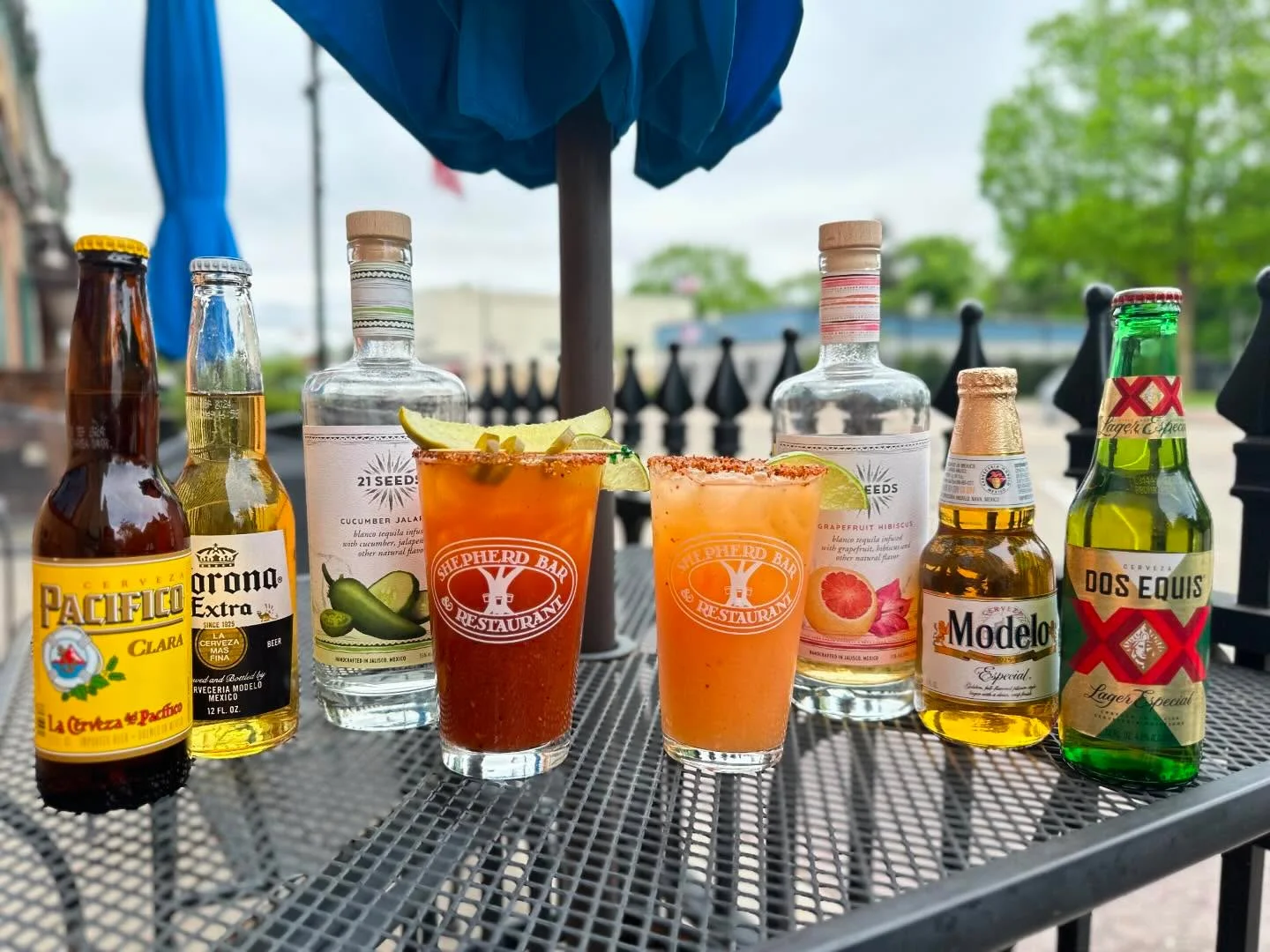 Variety of Mexican beers and cocktails on a restaurant patio