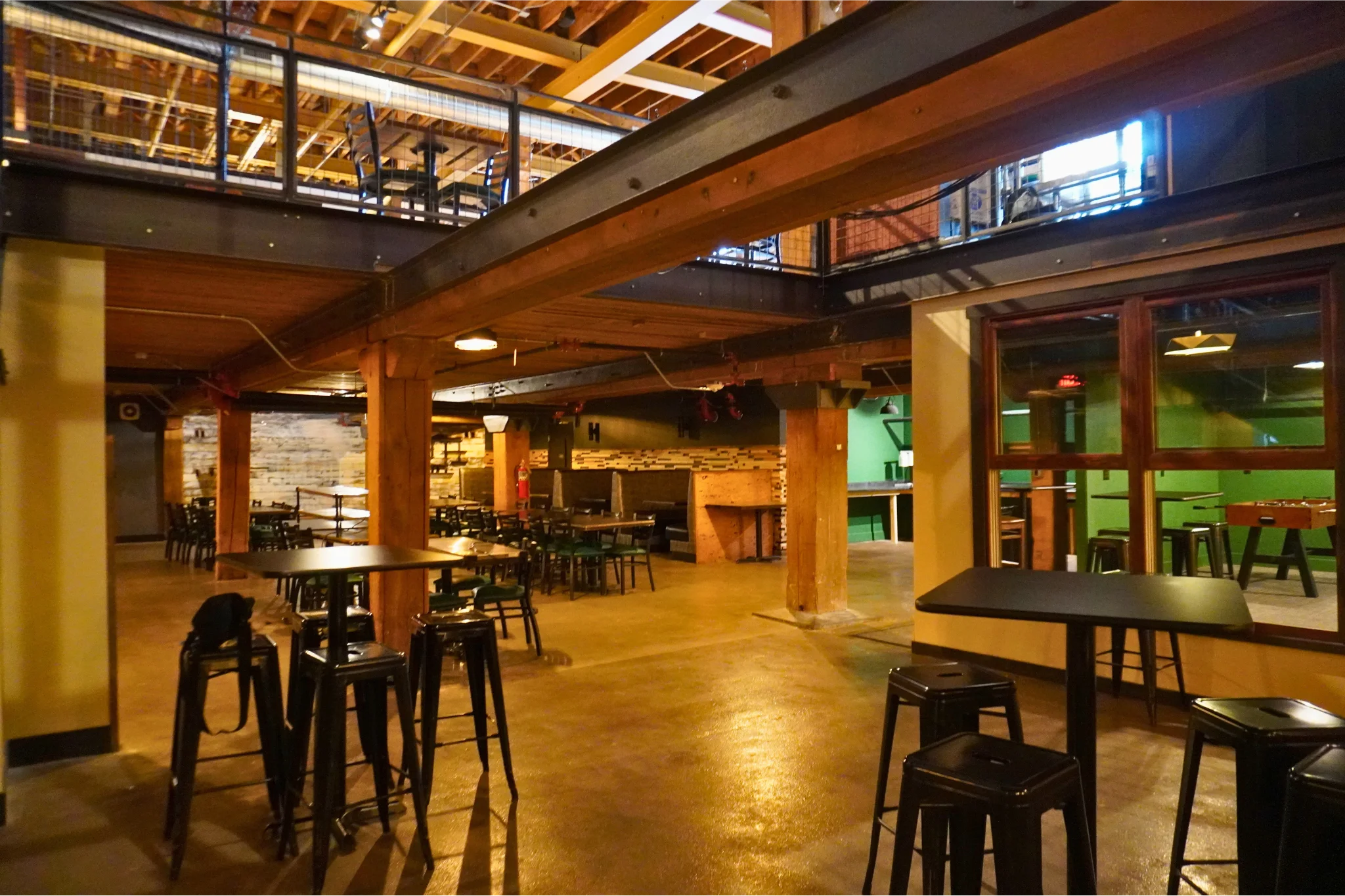Spacious restaurant interior with wooden beams and modern decor