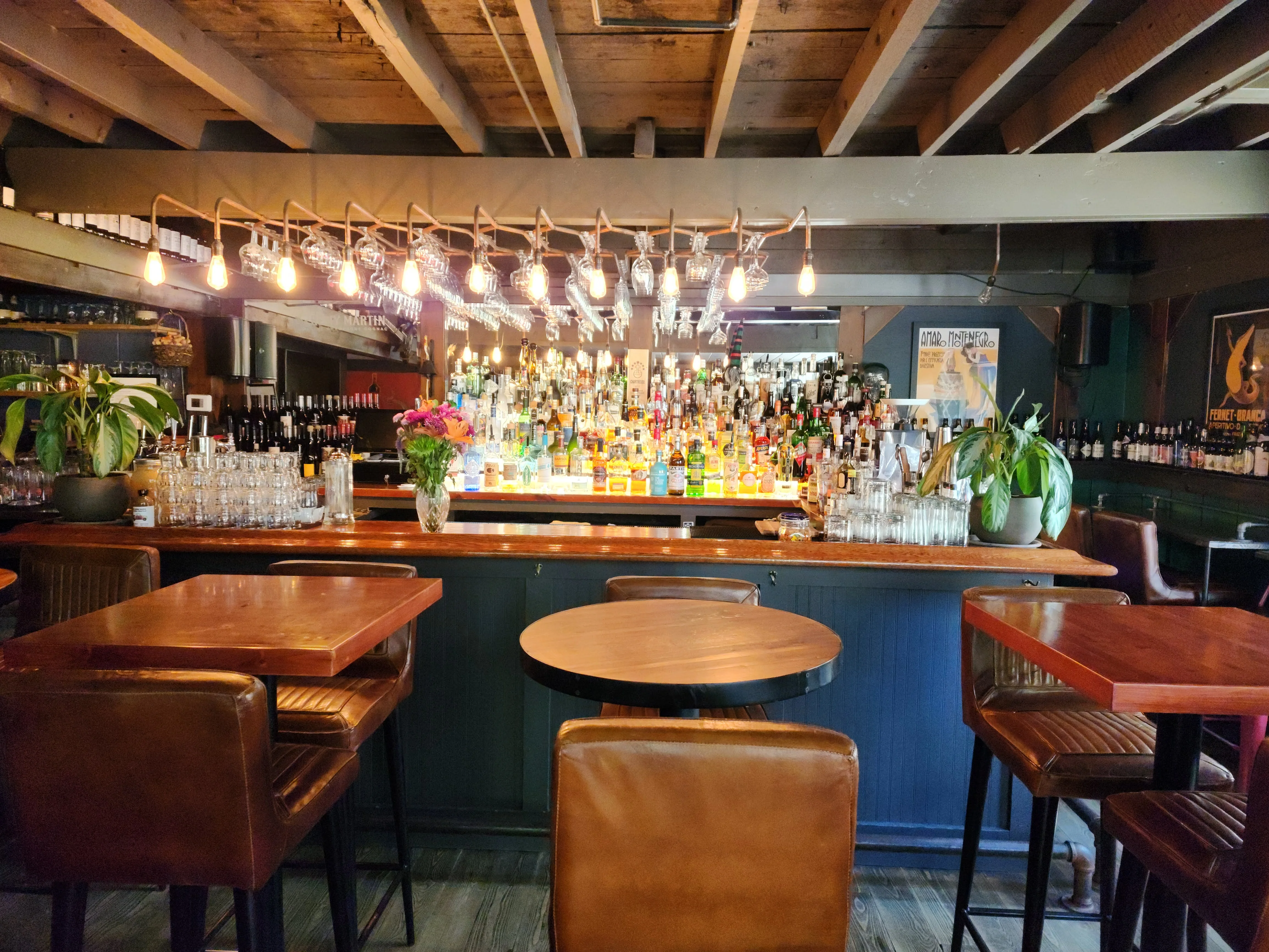 Stylish bar interior with a vibrant selection of spirits and warm lighting