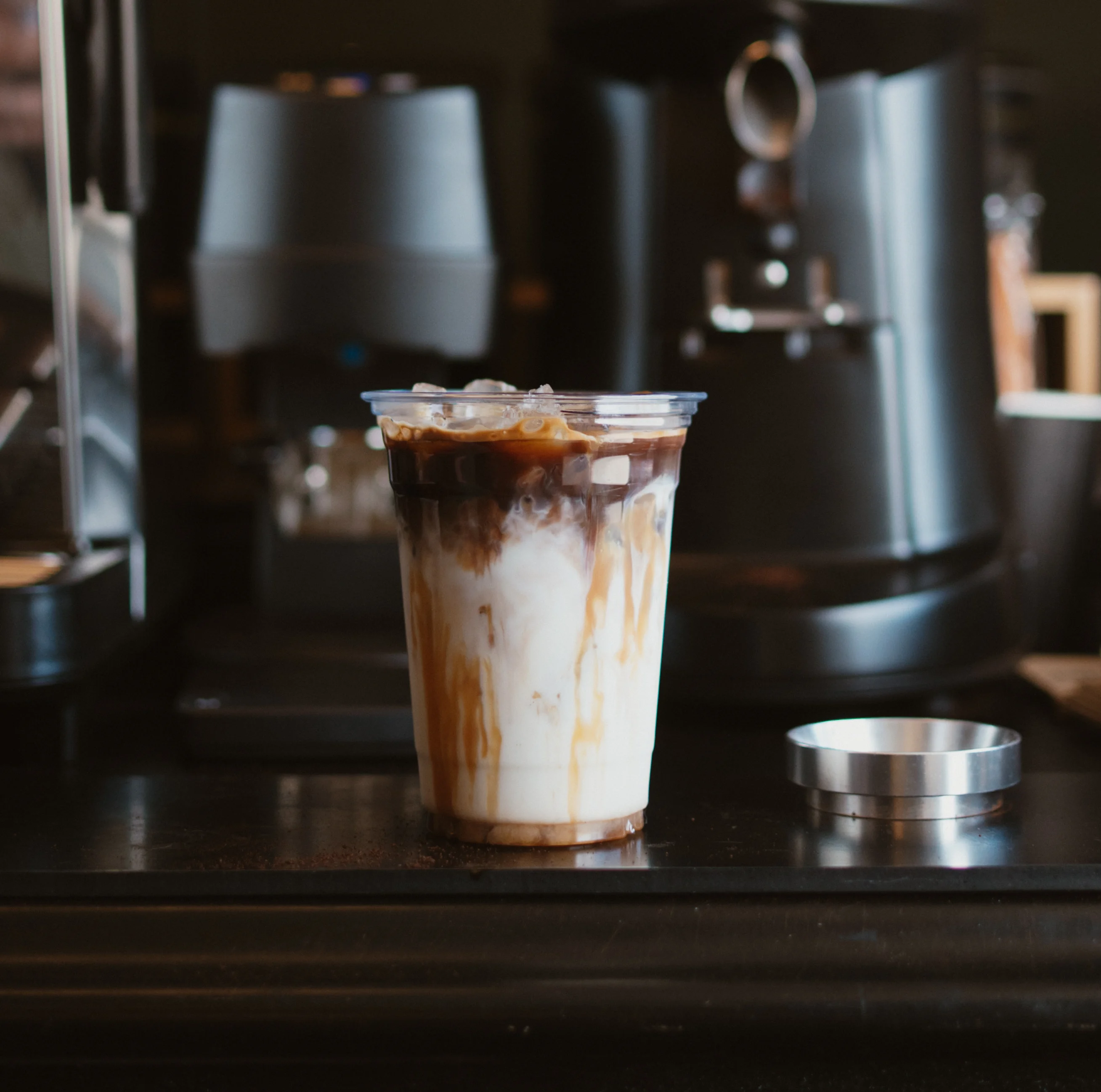 Iced coffee drink with layered milk and espresso