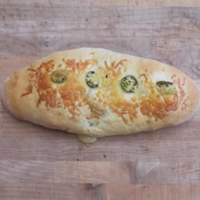 Cheesy jalapeño bread loaf, a savory baked delight