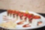 Japanese sushi platter with assorted rolls and garnishes