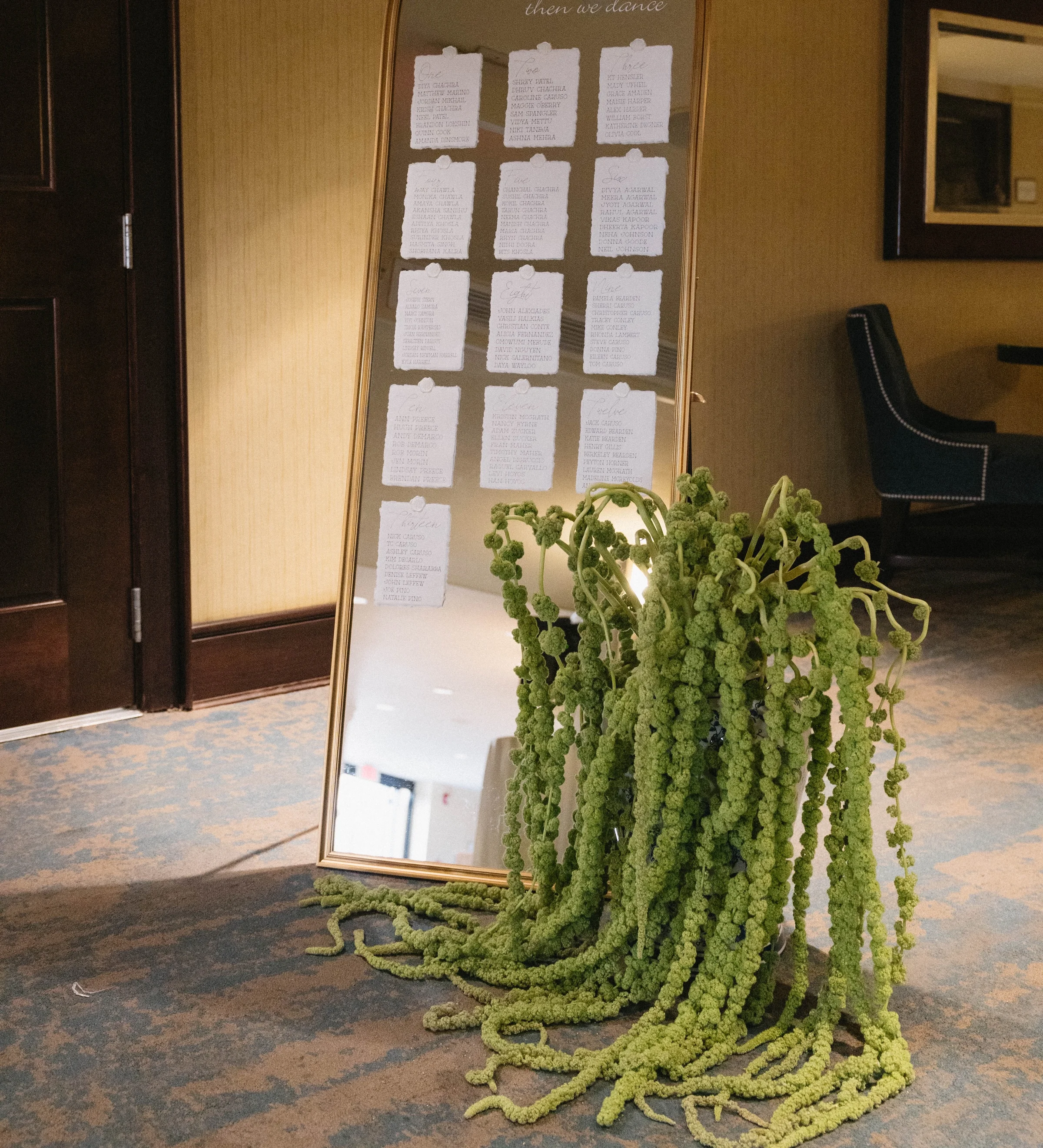Elegant mirror display for dining event with floral decor