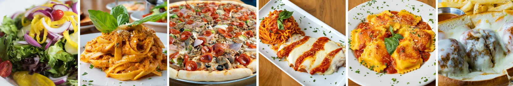 Italian pasta dishes and pizza assortment on a restaurant table