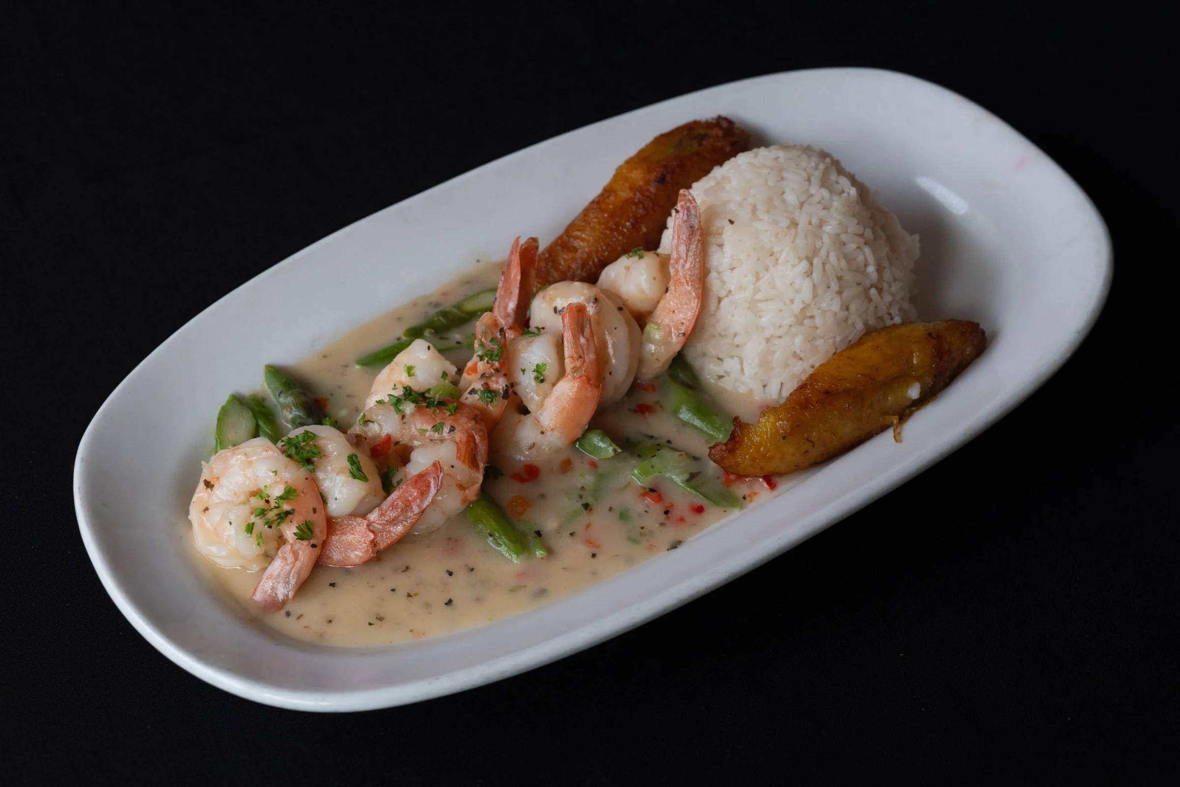 Shrimp in coconut sauce with rice and plantains