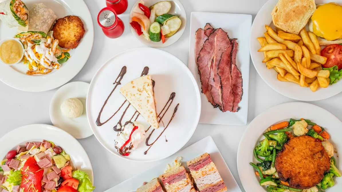 Assorted American diner dishes including roast beef and cheesecake