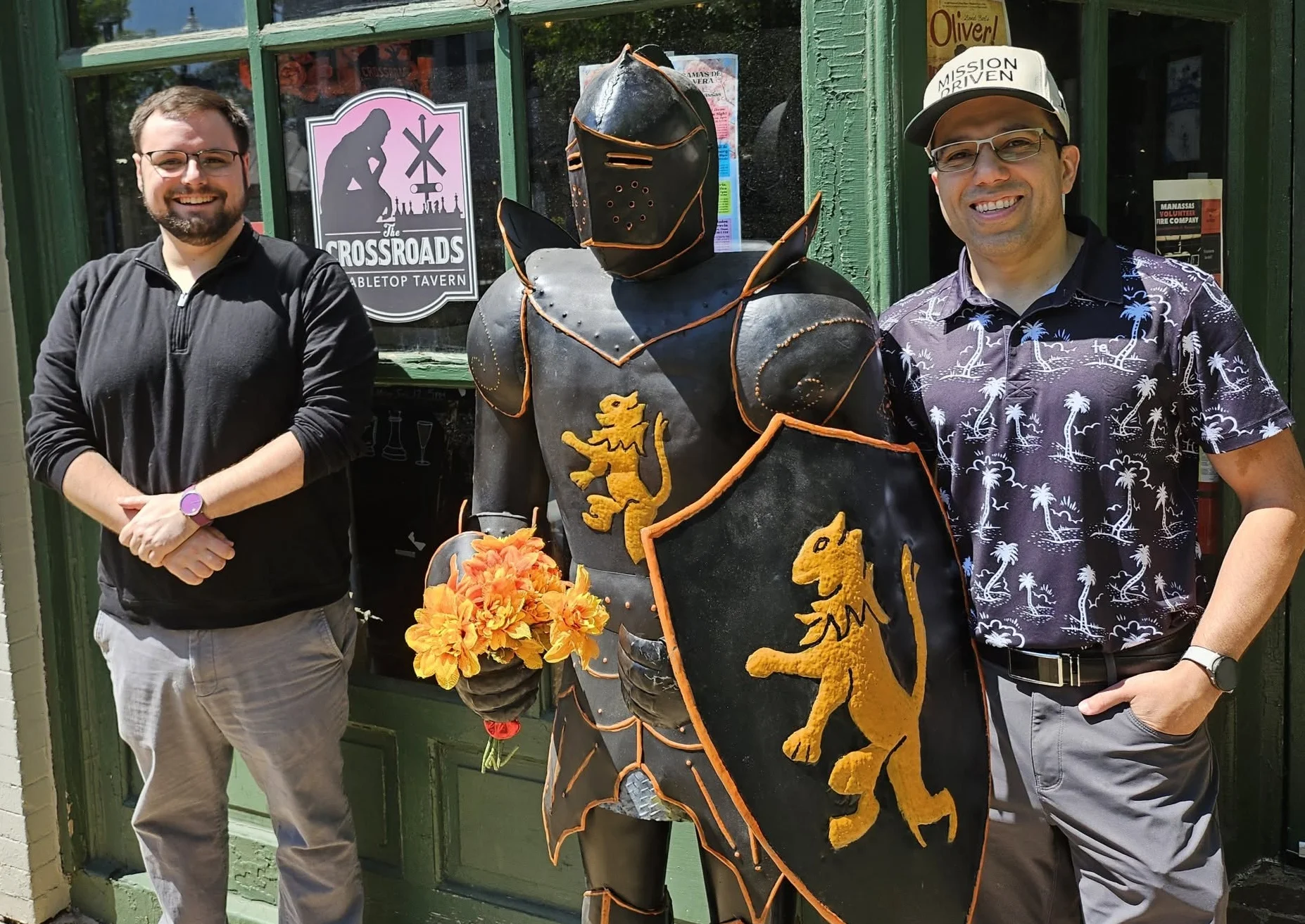 Owners Rob and Ryan posed outside the tavern with the knight armor display.