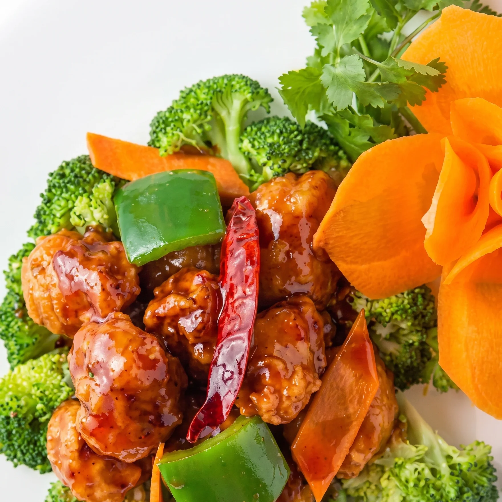 Sweet and sour chicken served on a bed of broccoli