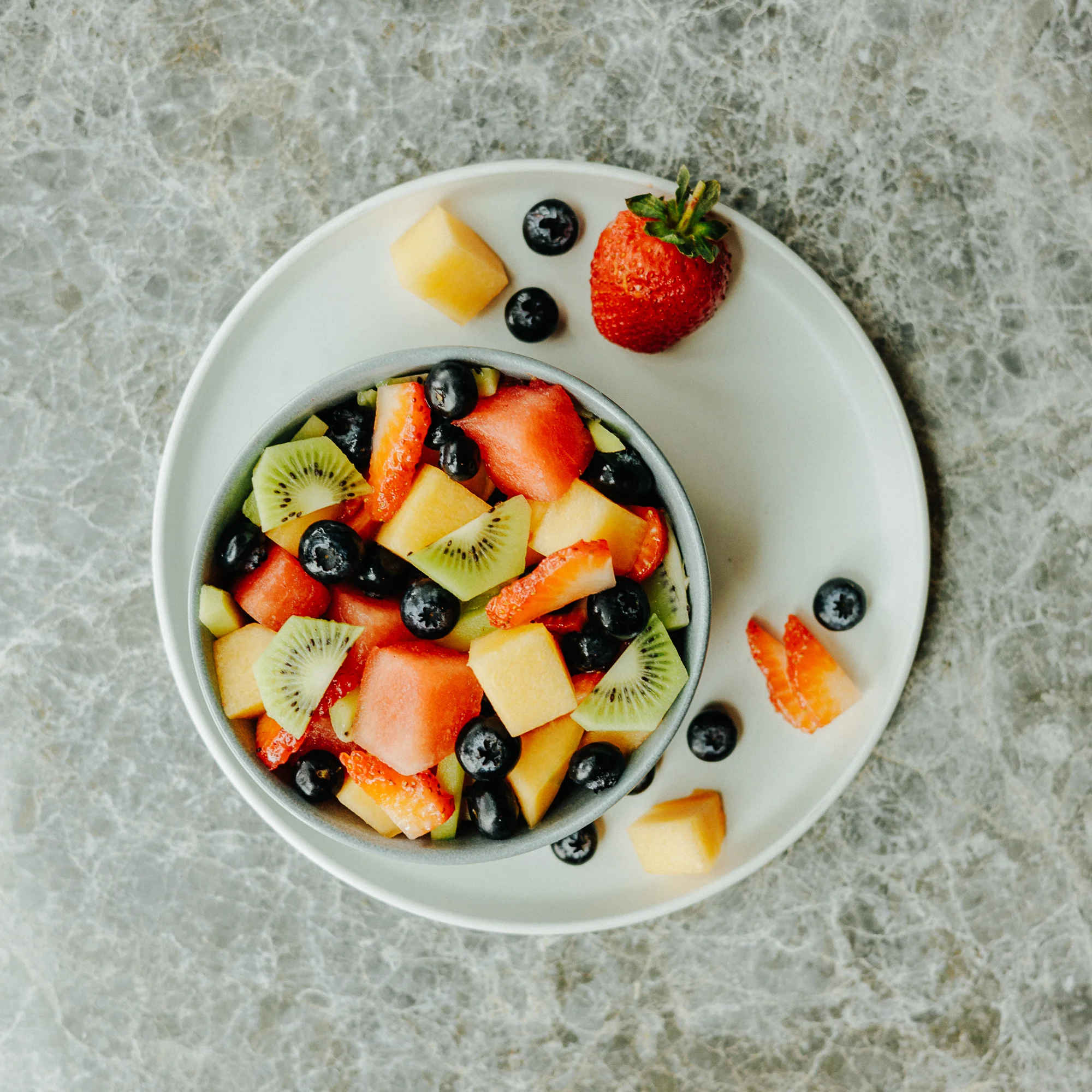 Colorful fruit salad in a bowl, showcasing fresh seasonal fruits