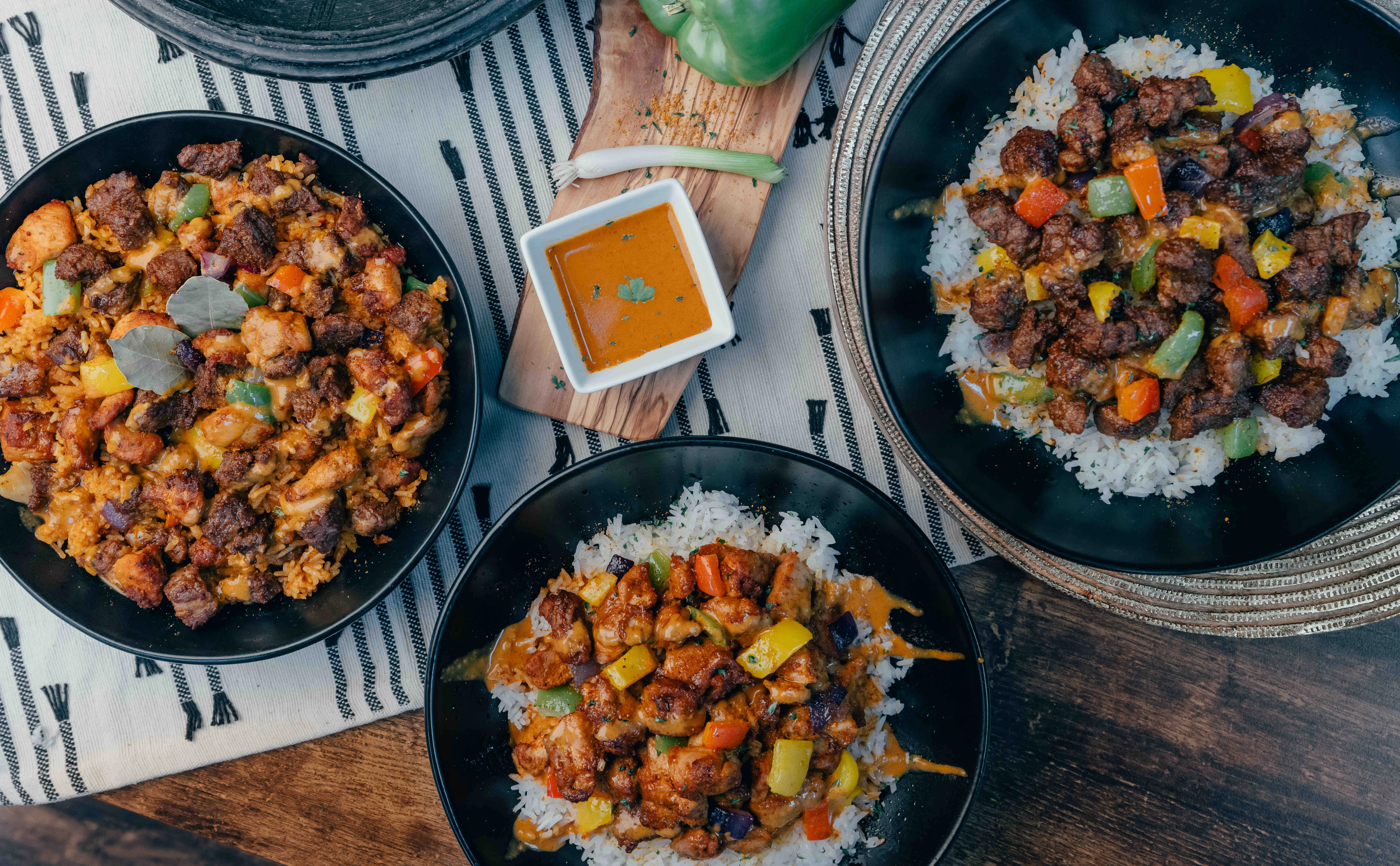 Nigerian jollof rice with grilled chicken and vegetables
