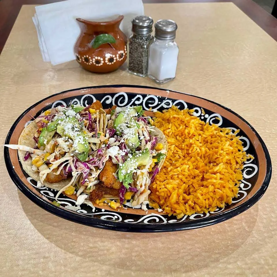 Crispy fish tacos with rice and slaw