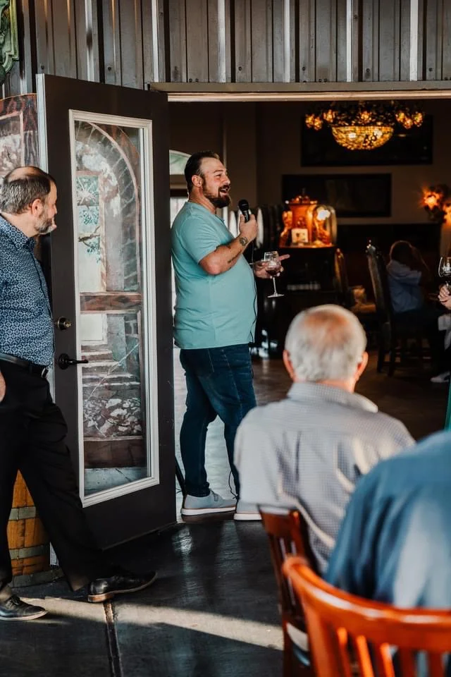 Speaker engaging guests in a cozy restaurant setting