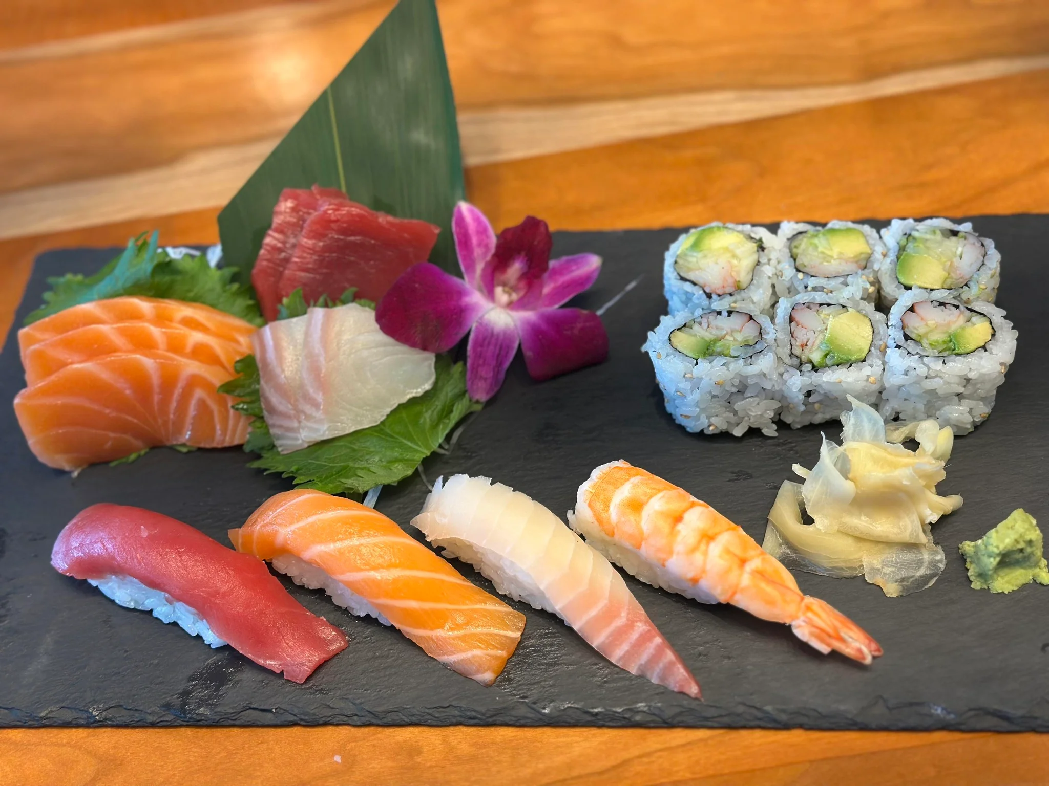 Assorted Japanese sushi platter with sashimi and rolls