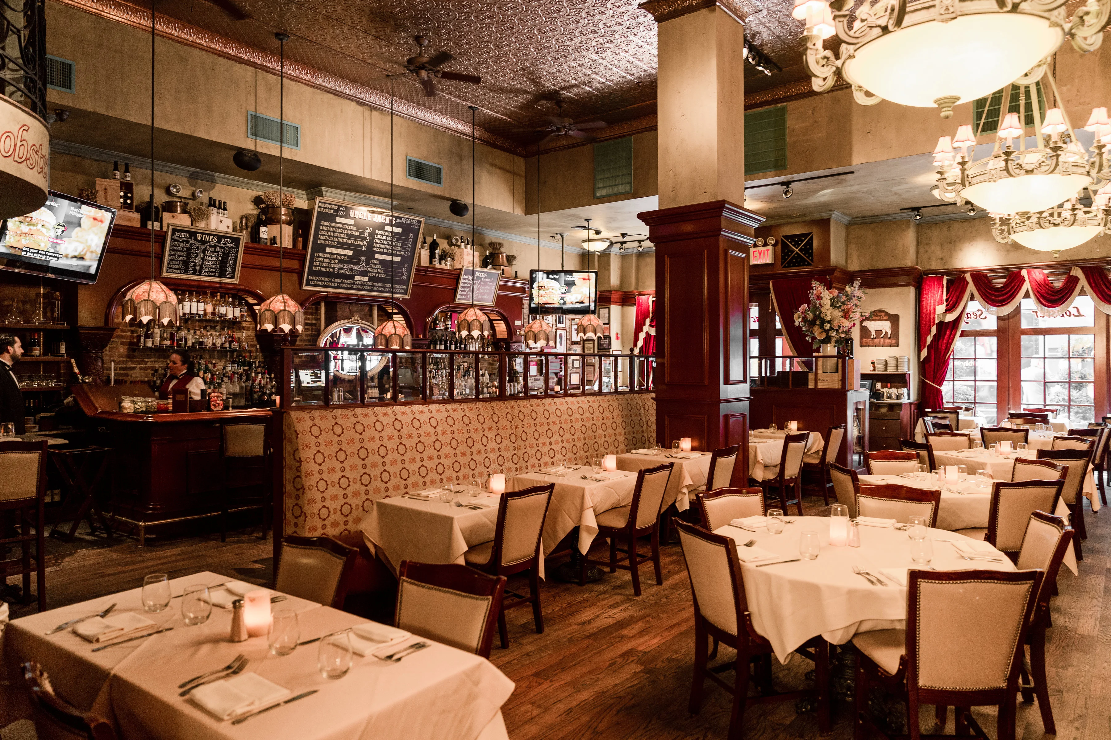Elegant restaurant interior with warm lighting and wooden accents