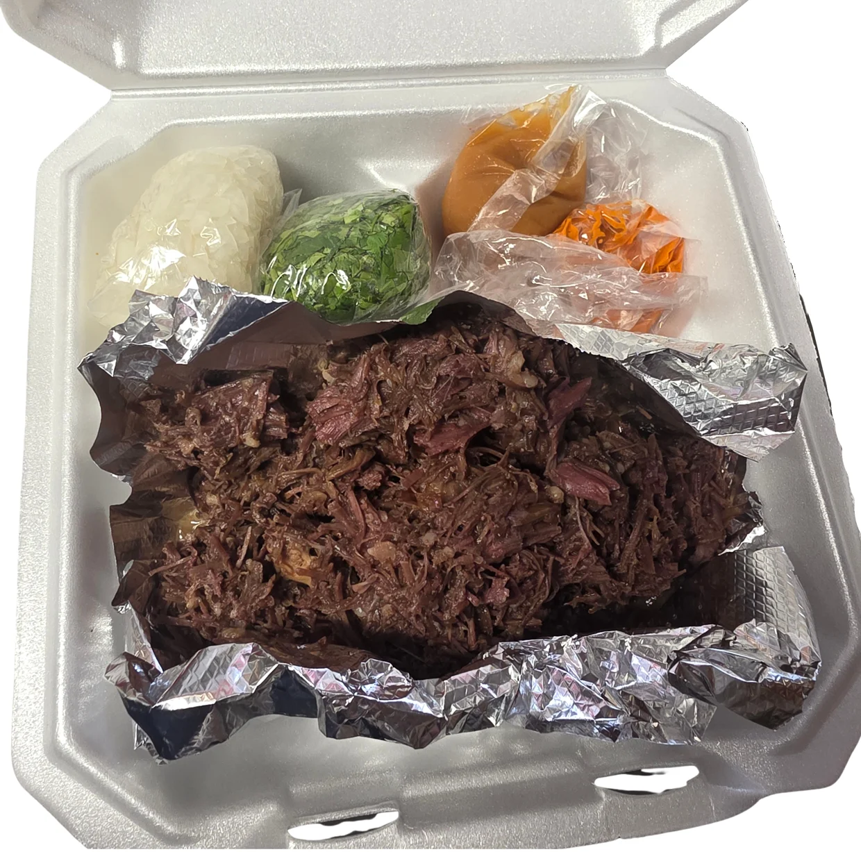 Tender Mexican barbacoa served with rice and fresh toppings