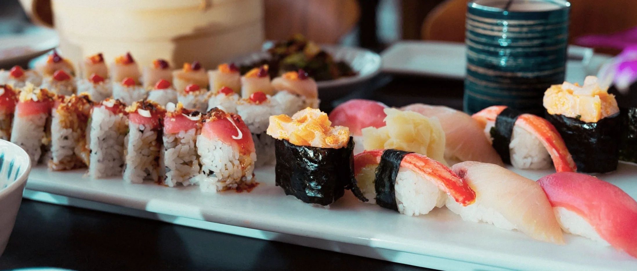 Assorted sushi platter featuring nigiri and rolls