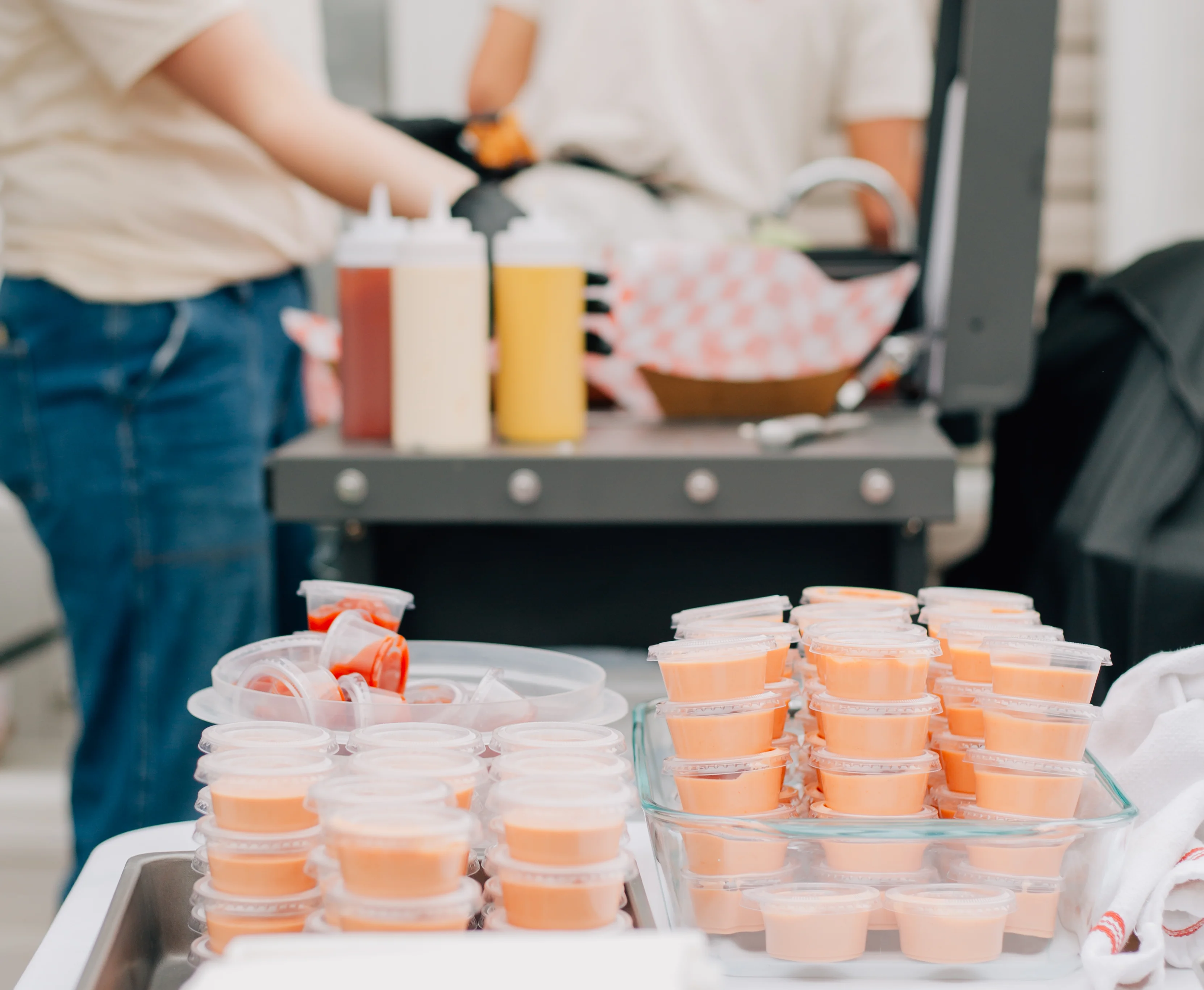 Condiments and sauces for burgers at a food event