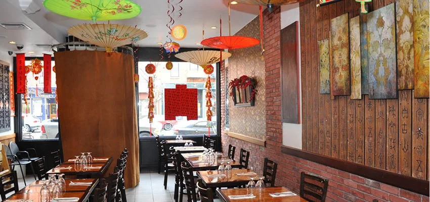 Cozy Asian restaurant interior with colorful umbrellas and warm decor