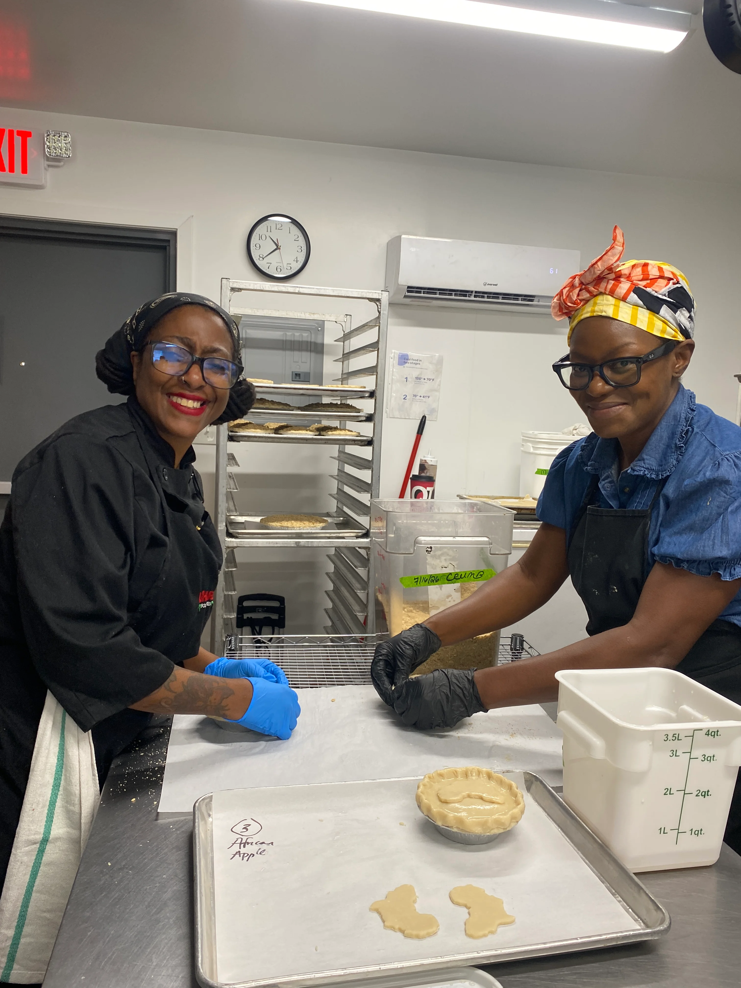 Bakers preparing African apple pie in a kitchen