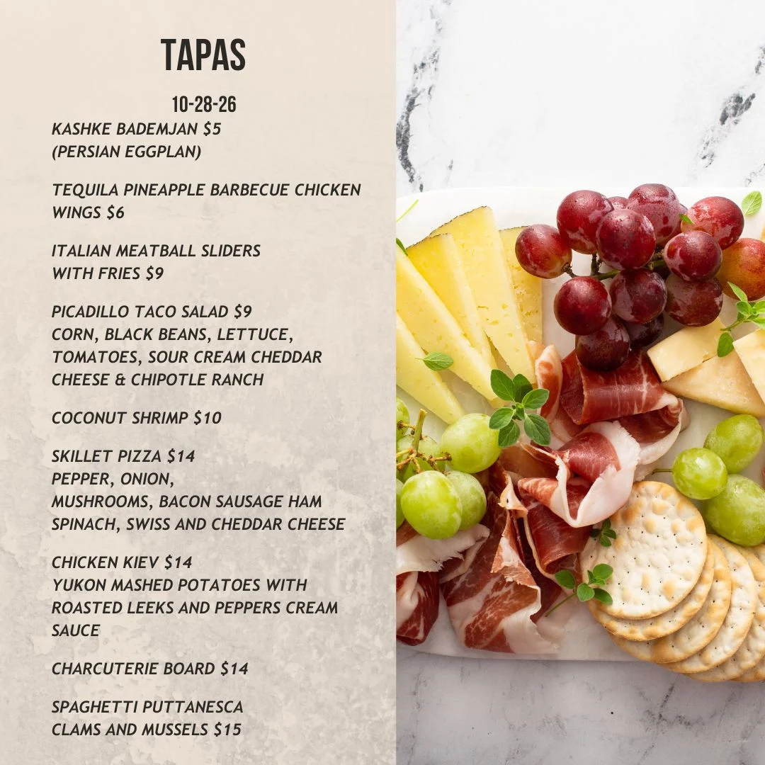 Tapas menu featuring a European charcuterie board with fruit, cheese, and crackers