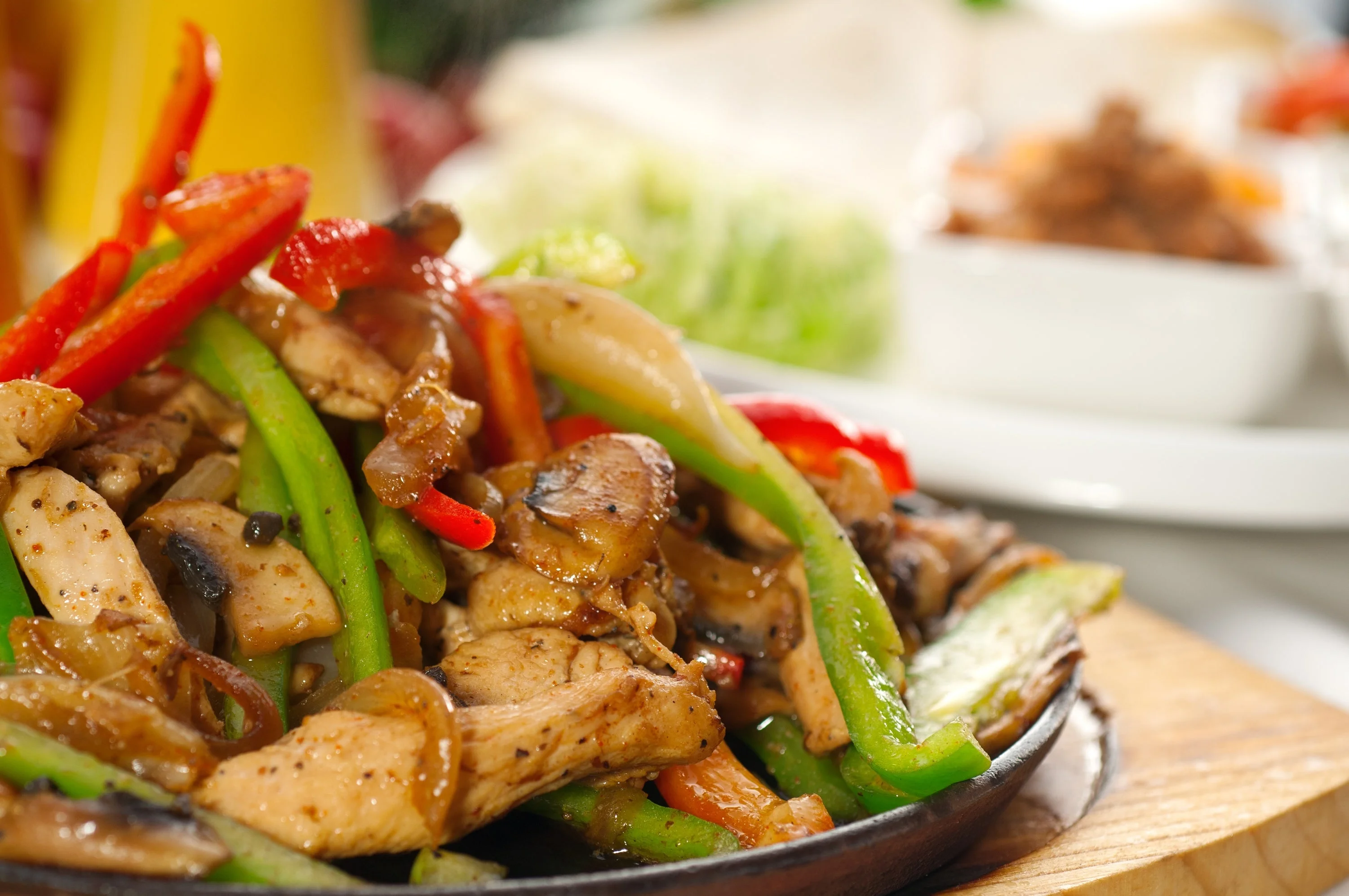 Sizzling chicken fajitas with bell peppers