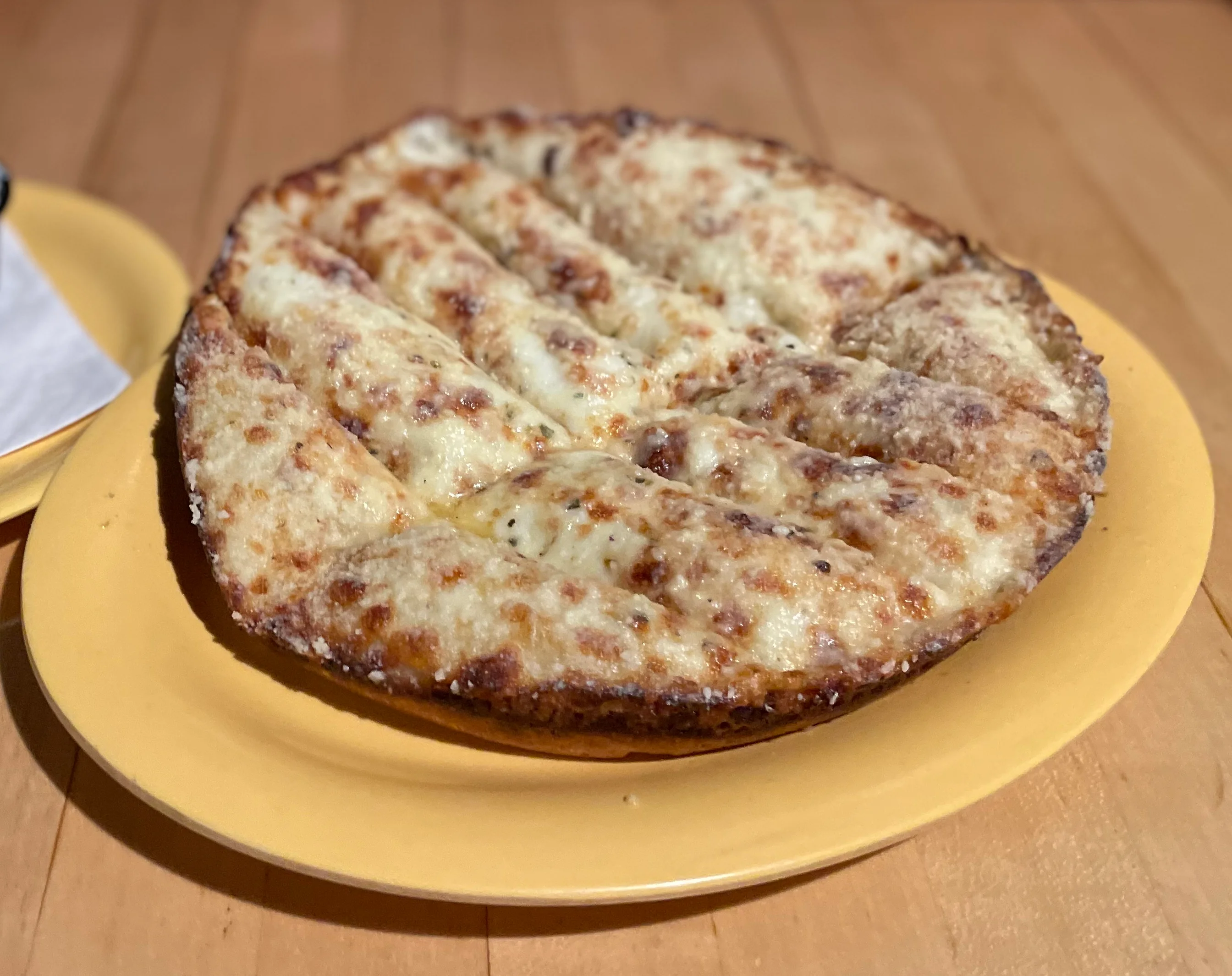 Cheesy garlic bread served with marinara and ranch dipping sauces