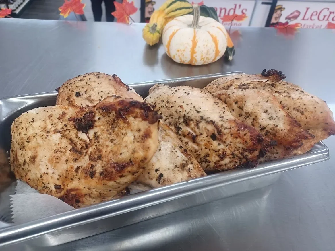Grilled chicken breast seasoned with herbs