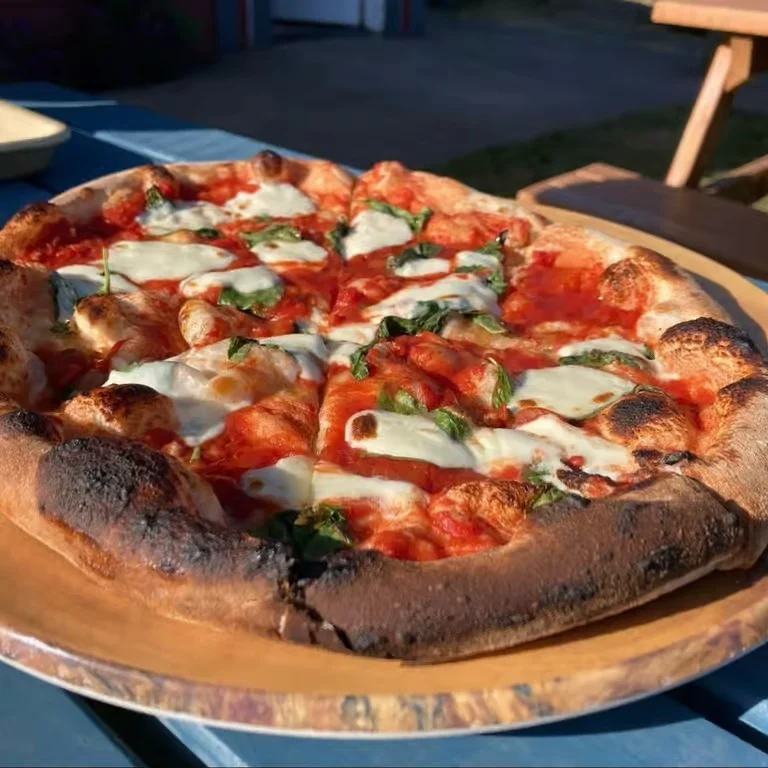 Exterior of Crab Rock Pizza restaurant with open sign