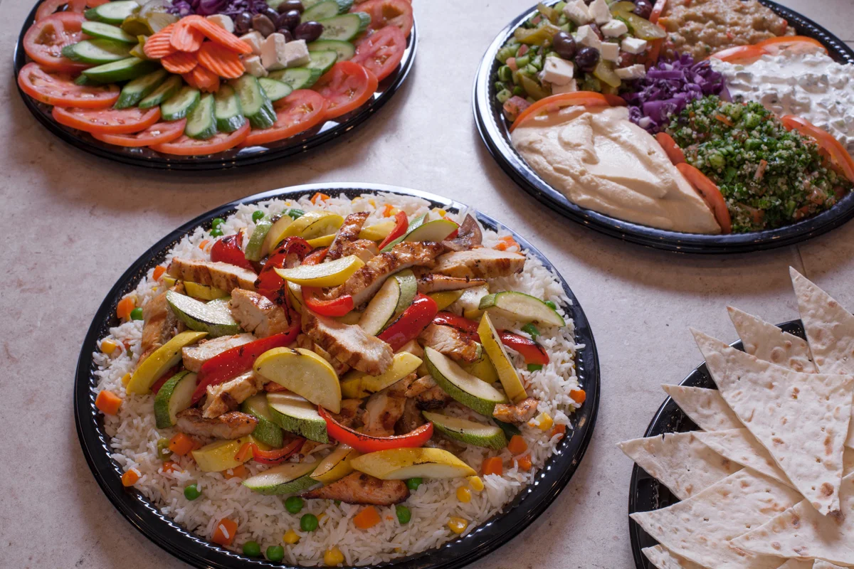 Mediterranean chicken rice platter with grilled vegetables