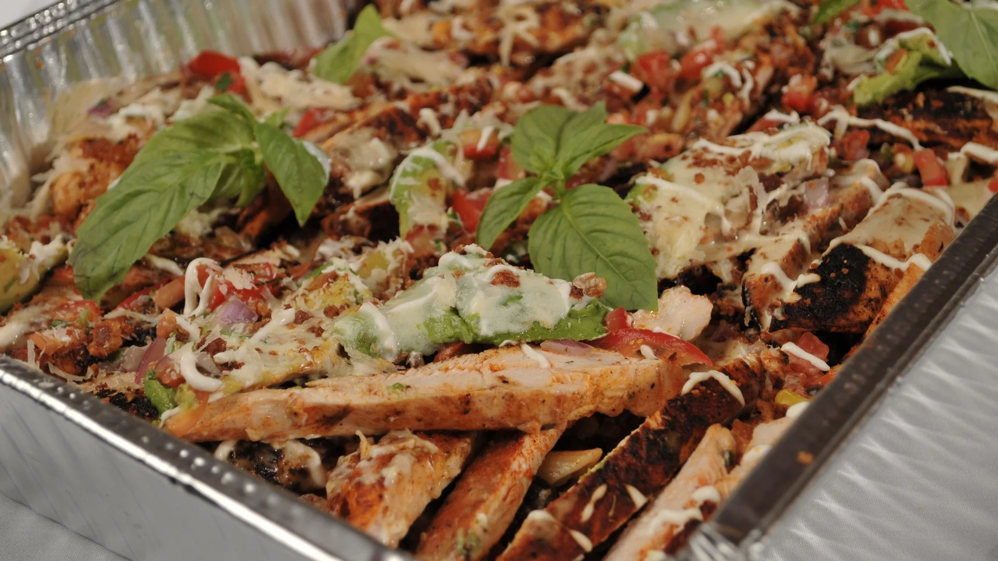 Penne pasta with chicken prepared for corporate takeout from Post Oak Grill Downtown Houston.