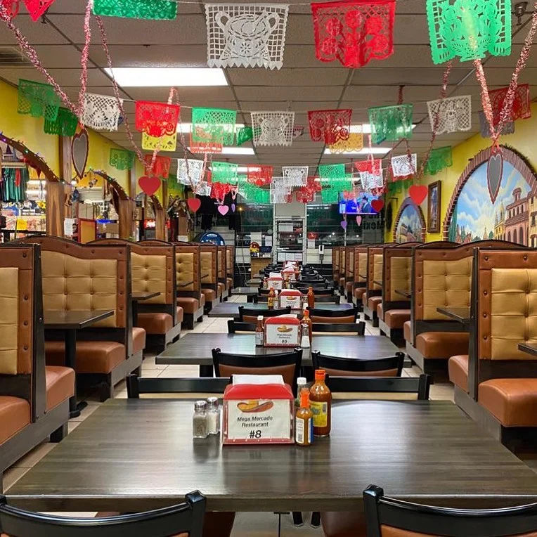 Colorful restaurant interior with festive decorations and seating booths