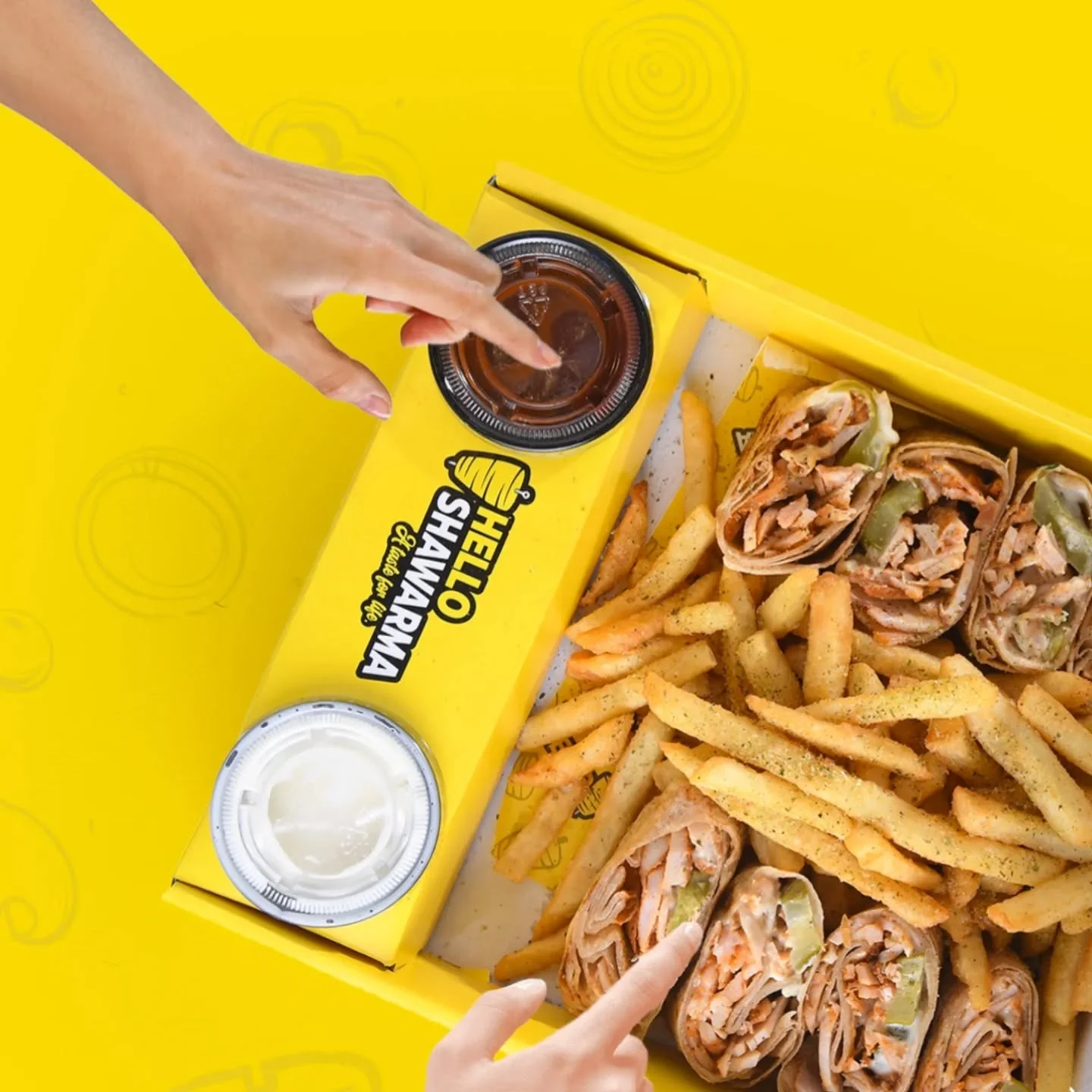 Delicious shawarma wraps with fries and sauces