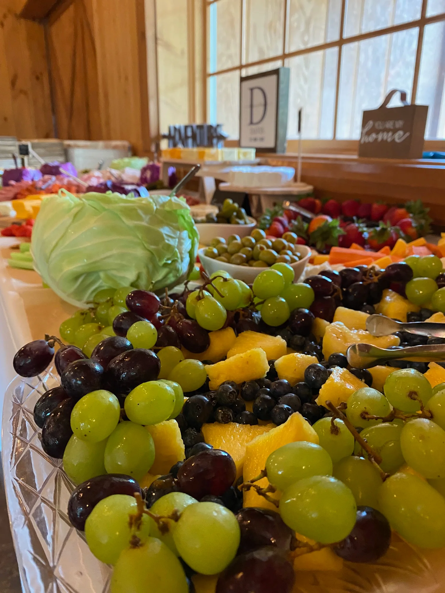Colorful fruit platter with grapes, pineapple, and blueberries