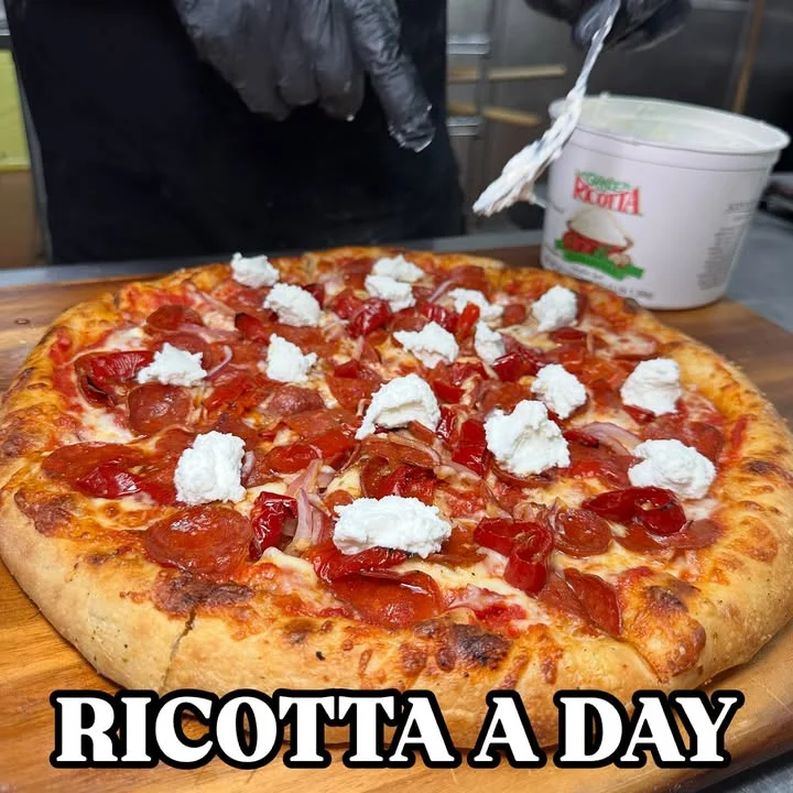 Pepperoni pizza topped with ricotta cheese