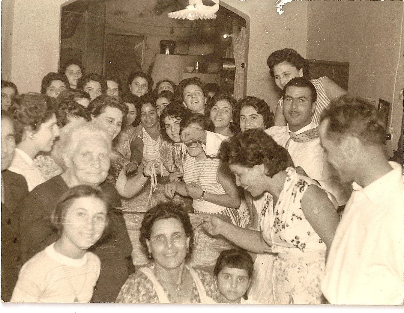 Group of people celebrating together in a cozy indoor setting