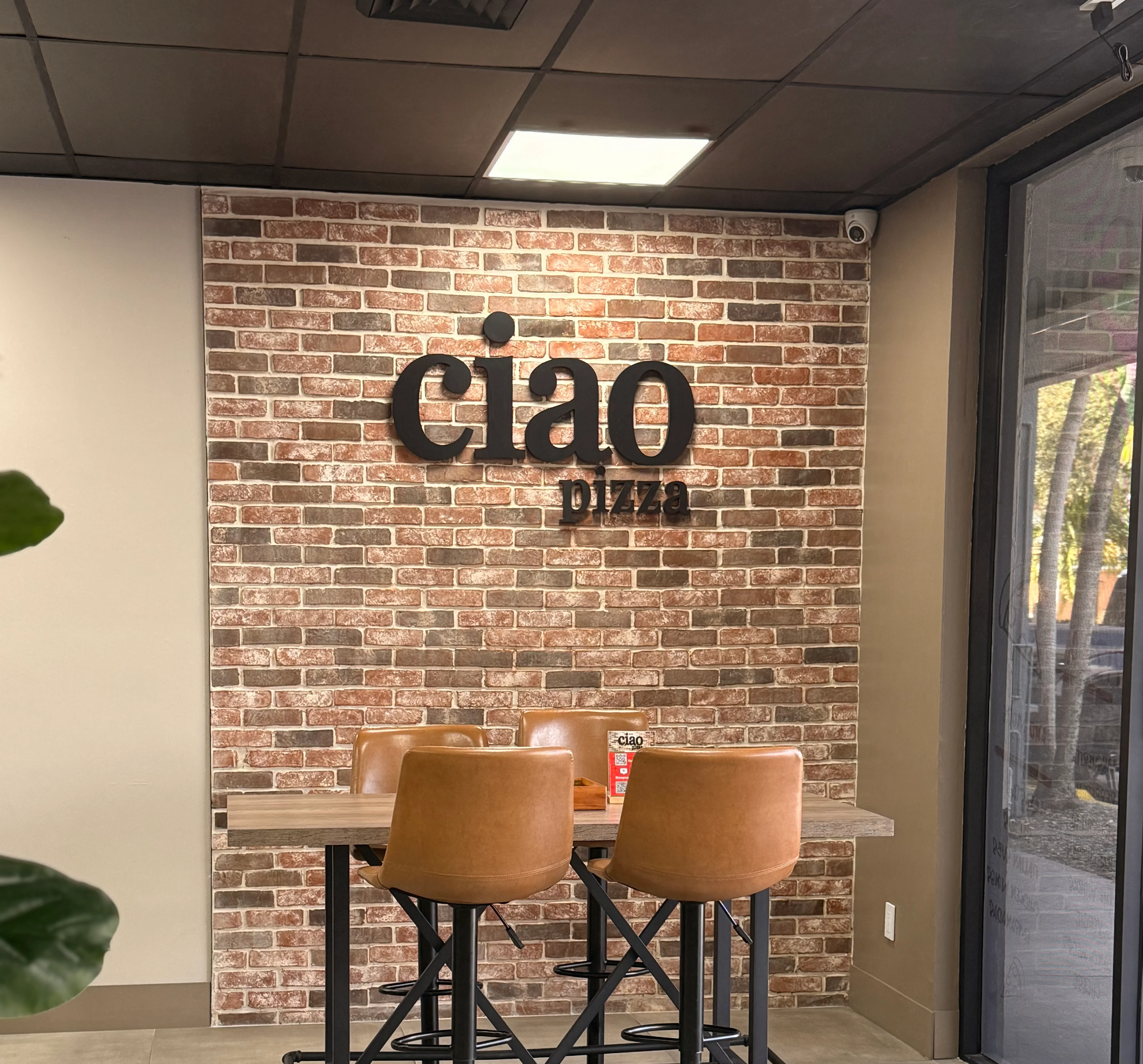 Cozy restaurant interior with exposed brick and modern seating