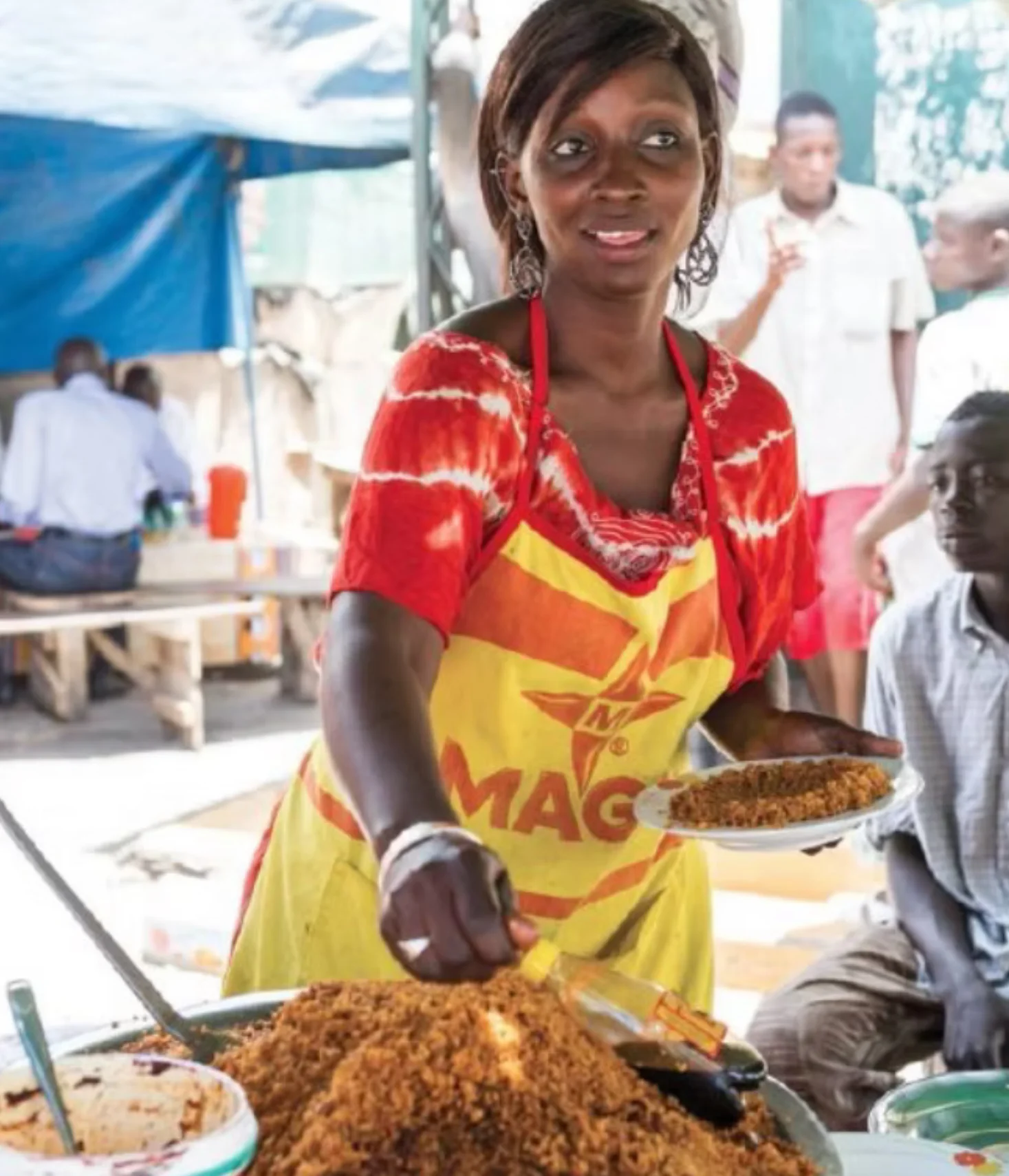 Senegalese Woman Cooking Jollof Rice