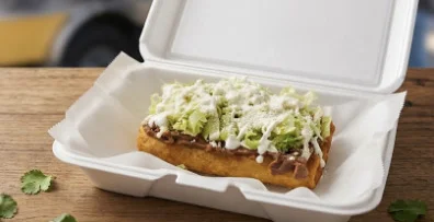 Delicious gourmet burger with fresh toppings on a wooden table