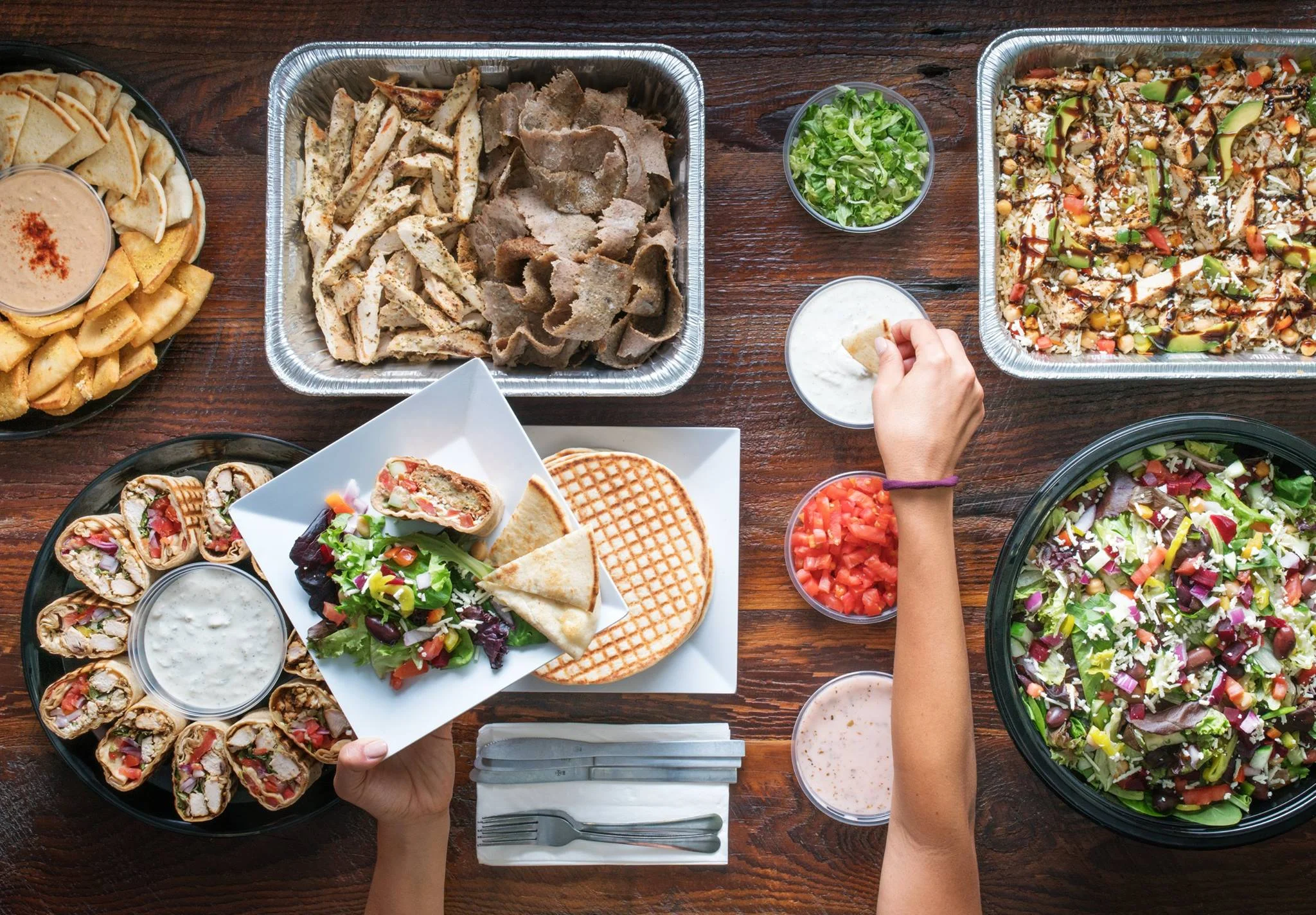 Mediterranean platter with shawarma, salad, and pita bread