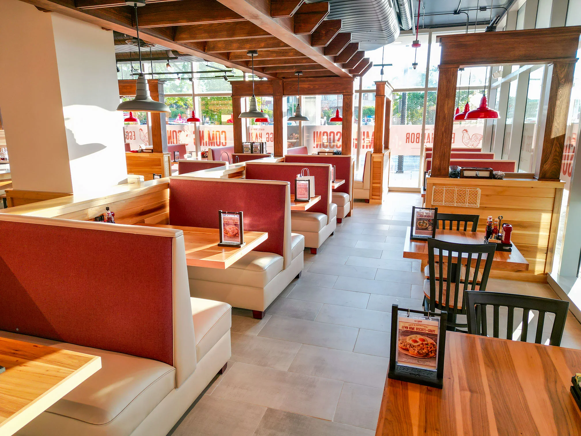 Modern restaurant interior with cozy booths and natural light