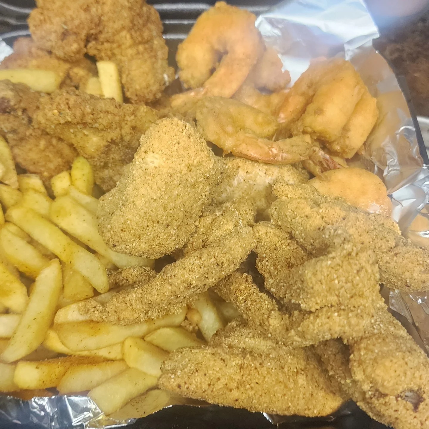 Southern fried seafood platter with shrimp and fries