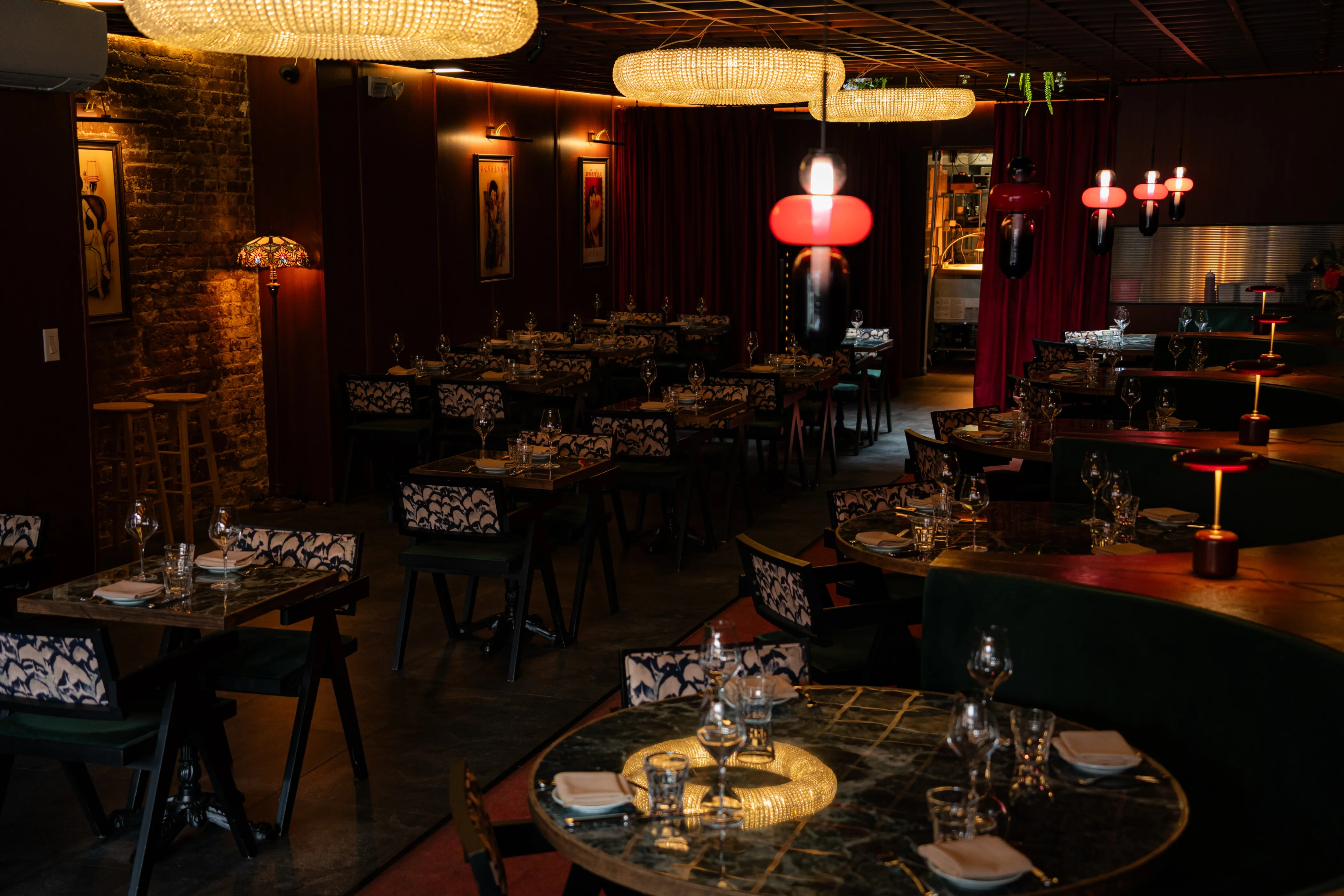 Interior view of a restaurant with tables and chairs arranged for dining.