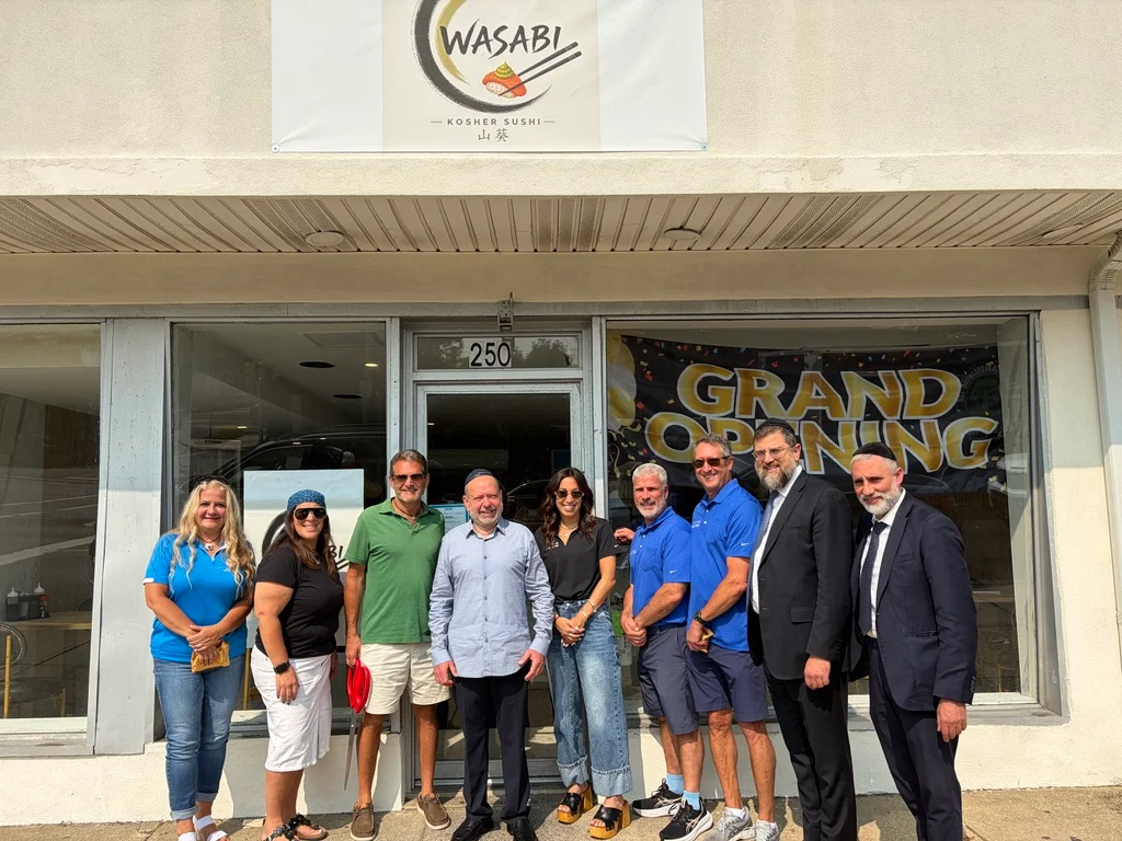 Group photo at the grand opening of Wasabi Kosher Sushi restaurant