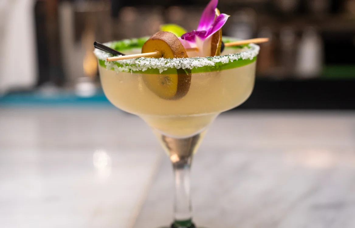Refreshing margarita cocktail with garnishes