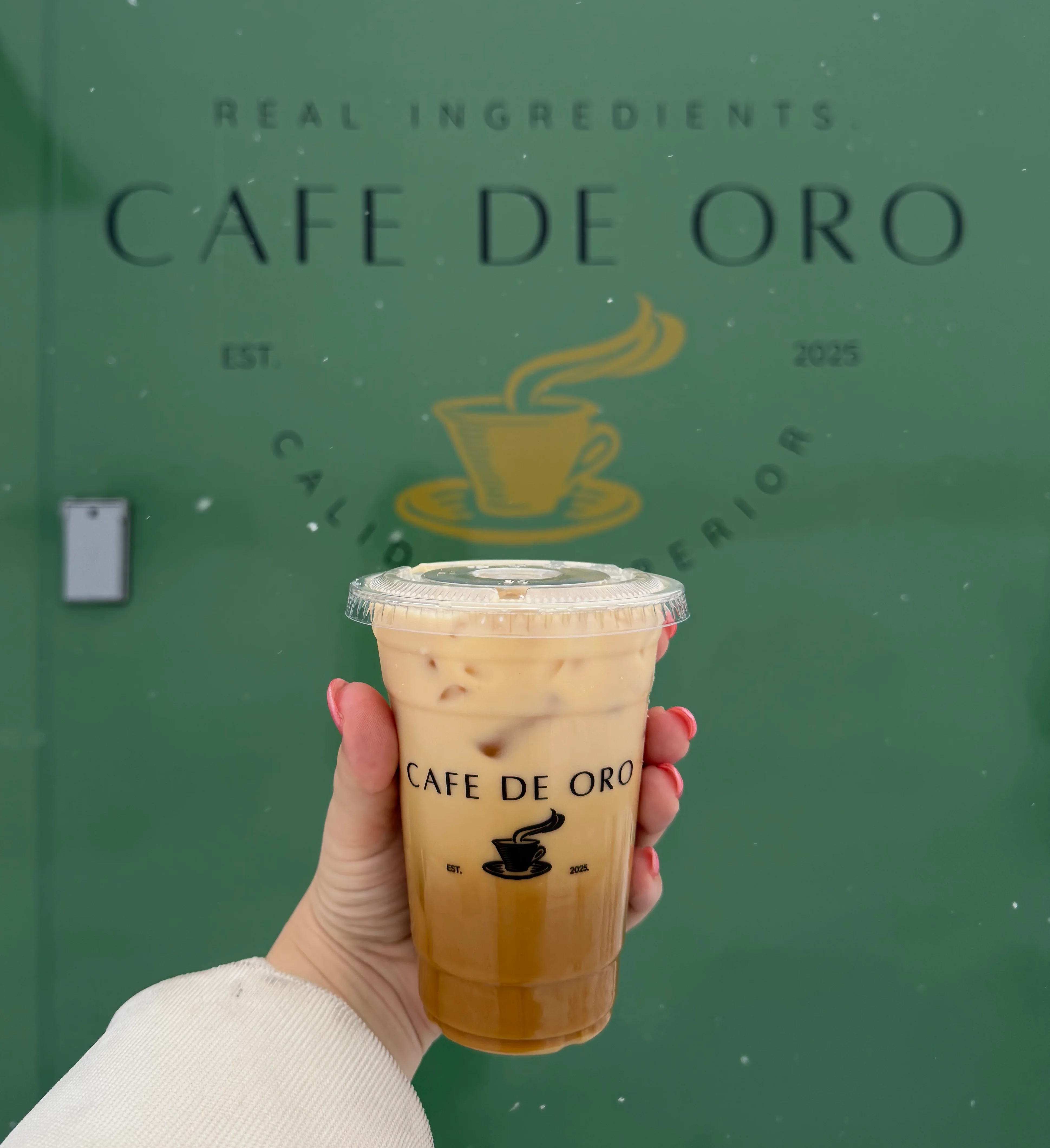 Iced coffee from Cafe de Oro in a cozy setting
