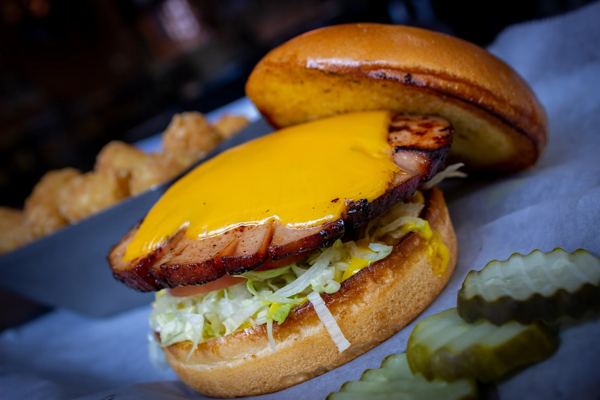 Smoked Bologna Sandwich at Main Street Pub with american cheese,  fresh lettuce, and pickles. Enjoy for lunch or dinner in downtown Spartanburg, South Carolina. 