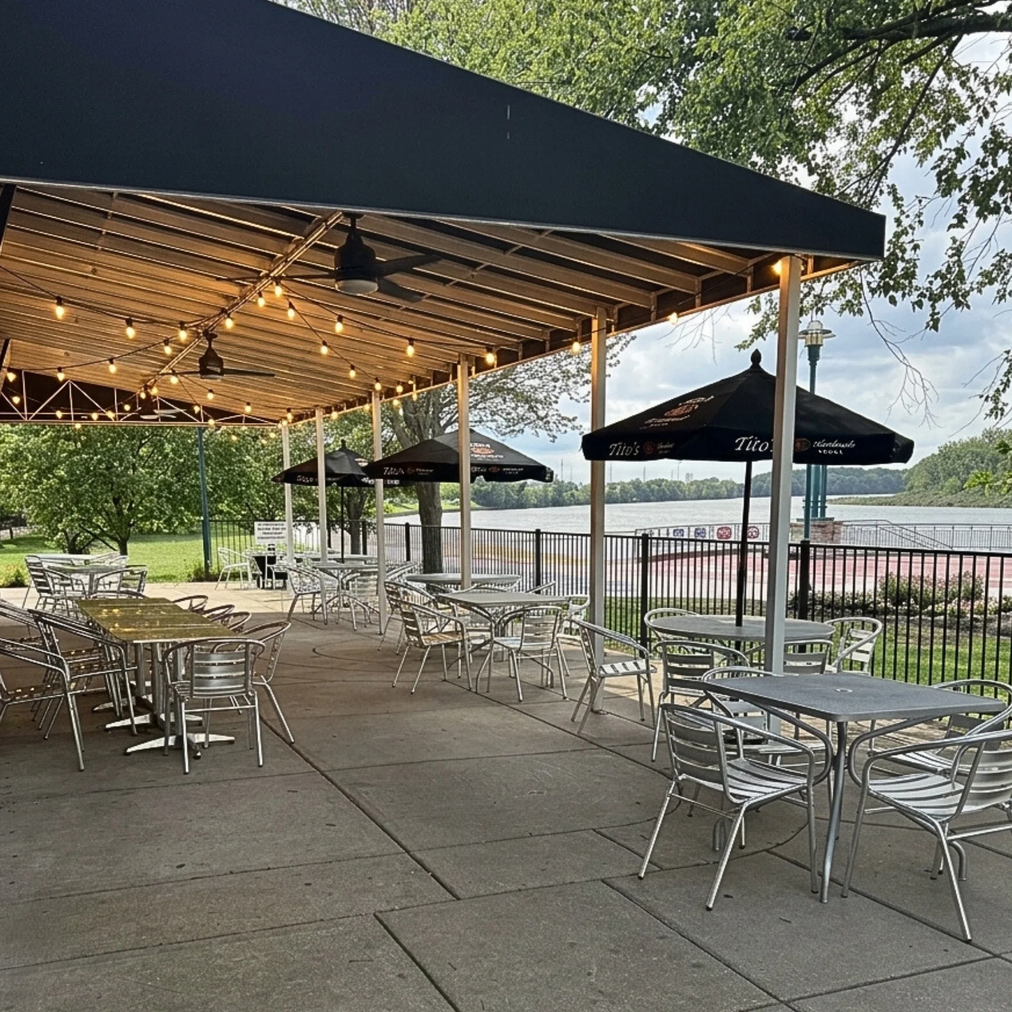 Outdoor riverfront patio at Bass Street in downtown Moline, IL along the Mississippi River