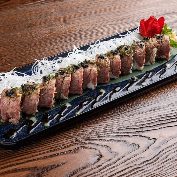 Japanese wagyu sushi rolls elegantly plated with garnishes